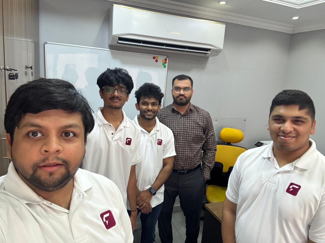 The research team in FILLIT polo shirts with a manager, in the office.